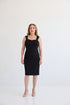 The Maverick Dress, Dress with sweetheart style neckline, sleeveless with shoulder straps, knee length, and back slit for ample movement. Dress in color black. 