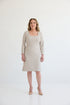 The Medora Dress, Dress with square style neckline, 3/4 length sleeves, knee length, and side slits for ample movement. Dress in color beige.
