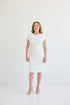 The Monroe Dress, Dress with jewel style neckline, cap sleeves, knee length, and back slit for ample movement. Dress in color white. 